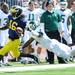 Michigan junior quarterback Denard Robinson runs the ball past Eastern Michigan defensive back Willie Williams during the third quarter against Eastern Michigan at Michigan Stadium on Saturday. Melanie Maxwell I AnnArbor.com